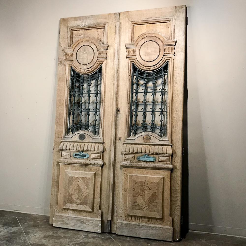 Hand-Crafted Pair of 19th Century Carved and Stripped Oak Doors with Wrought Iron