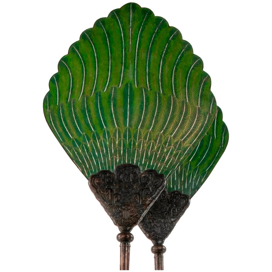 A pair of hand craved zitan wood elephants, gallery plinths and poles with towering bronze cloisonné Chinese fan palm leaves.