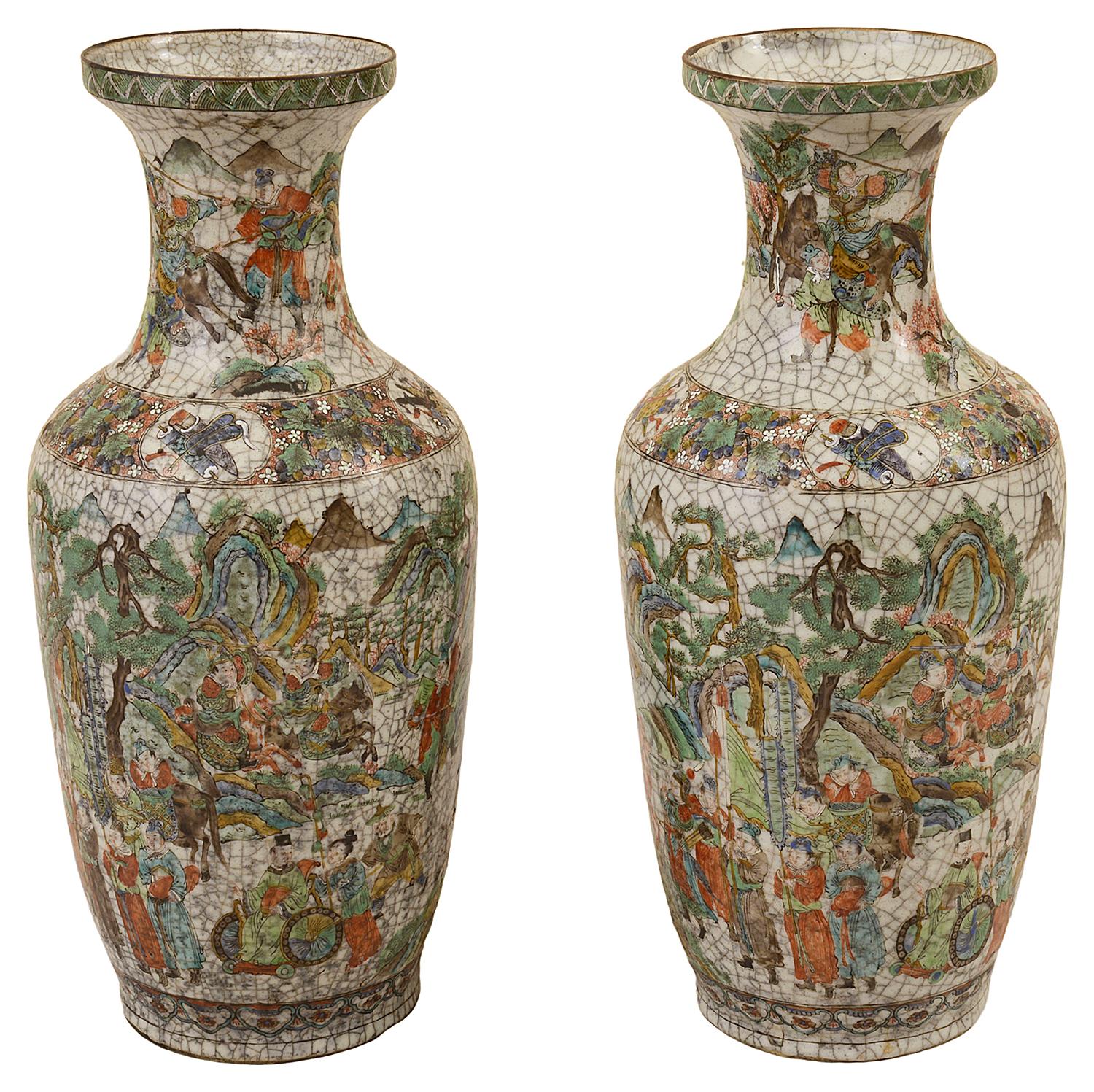 A good quality pair of late 19th century Chinese crackleware vases/lamps, each with hand painted scenes depicting warriors, courtiers and scholars.
The vases can be wired as lamps if required.
     