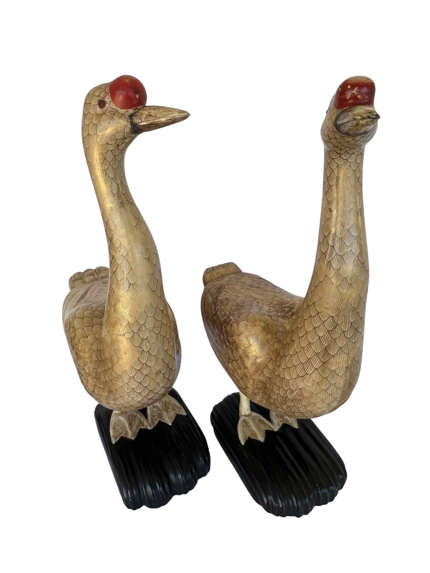 Presented are a pair of extremely rare Chinese Export carved wood, gilt and lacquered geese statues. Fine quality carvings that are a true opposing pair and high quality. From the estate of a former Georgia governor.