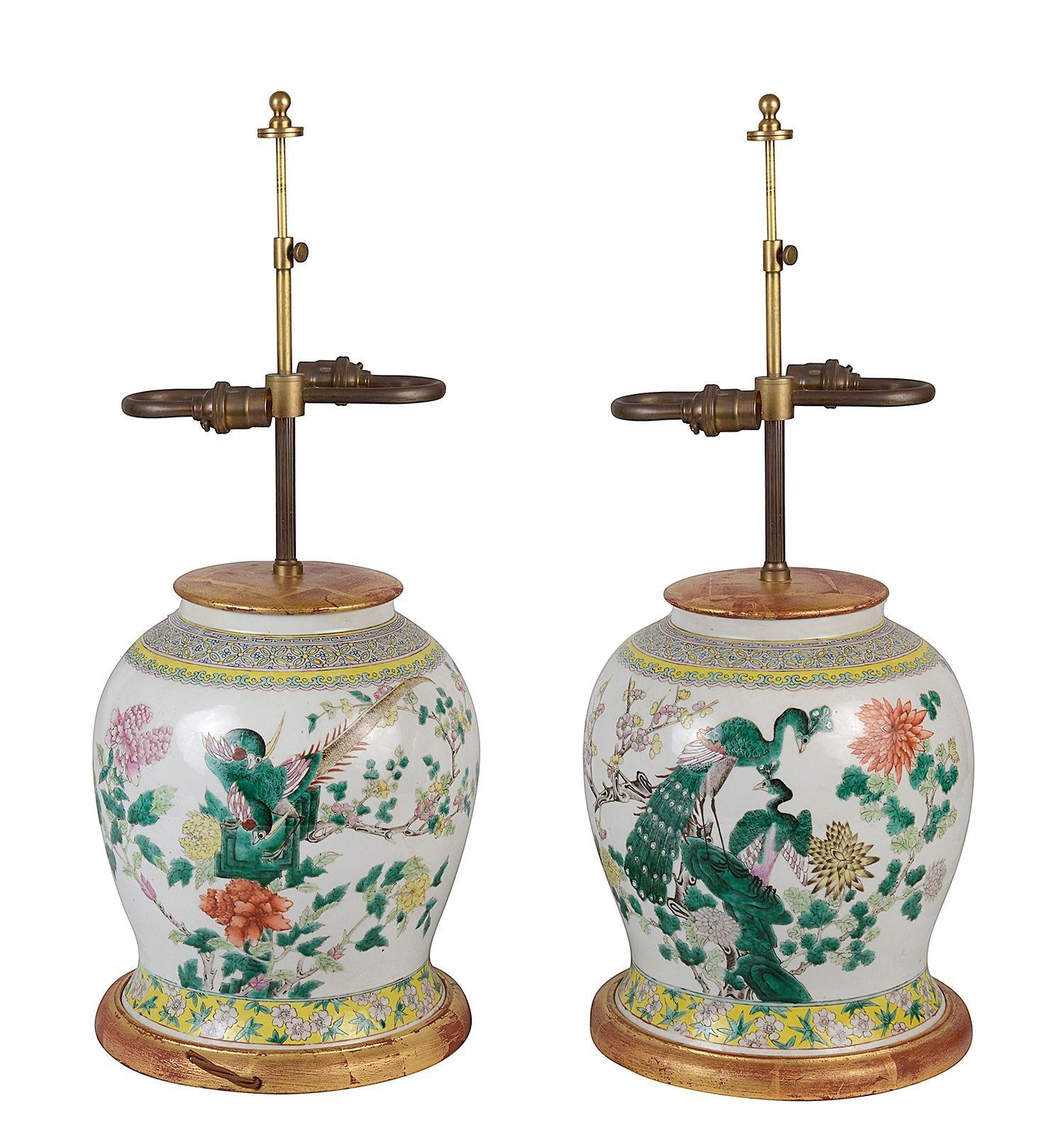Pair of 19th Century Chinese export Famille Rose Ginger jar lamps, each with wonderful bold coloured exotic birds and flowers, turned gilt wood stands and lids.

Batch 76 G9740/22 TNYZ