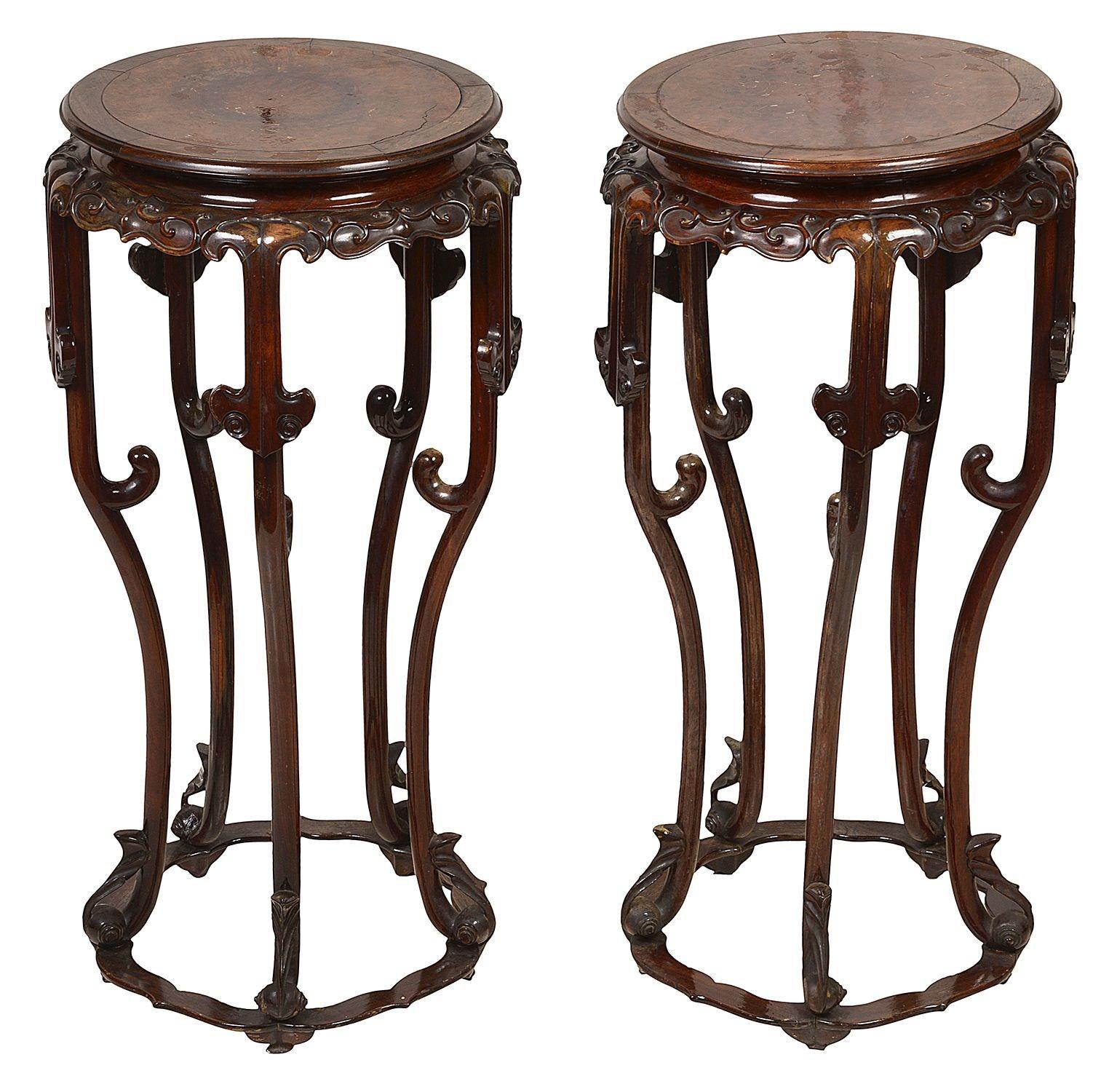 A very good quality pair of Chinese hardwood, hand carved stands, each with inset burr wood panels to the top, scrolling blind fretwork to the frieze, raised on four elegant shaped supports, united by a stretcher below.
Batch 68 1/2cmc 58148