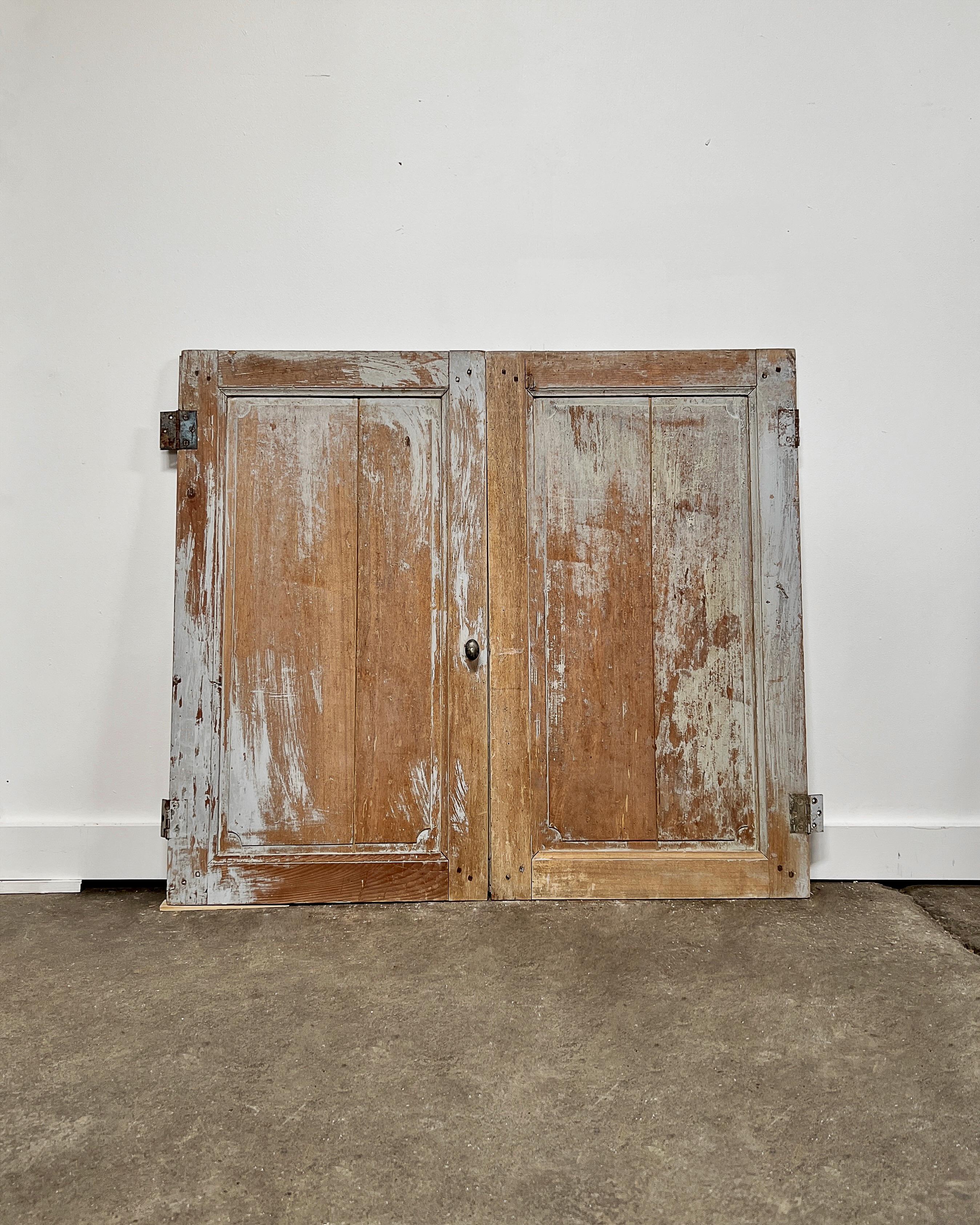 A pair of reclaimed paneled cupboard doors have grooved trim details. Enclose a built-in cabinet with this charming pair of doors to feel as if you’ve been transported to the French countryside.

Salvaged in France, 19th century.

Natural pine with