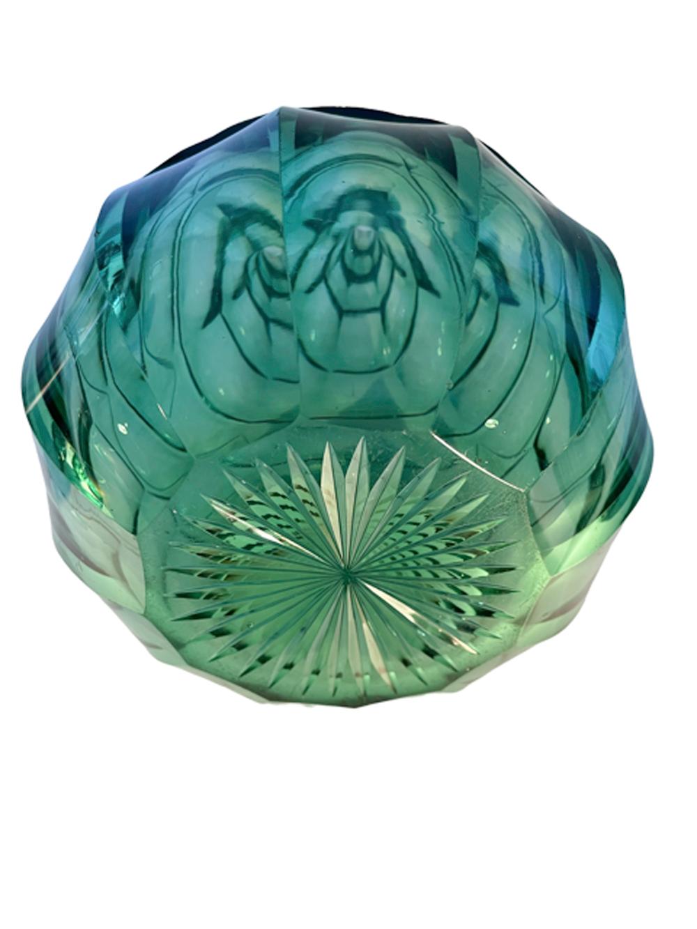 Pair of elaborately cut emerald green glass Anglo-Irish decanters of bulbous form with tiered bands of lobe-cut panels from the top of the neck to the widest point then continuing with panels to the star cut bottom, each with its original ball