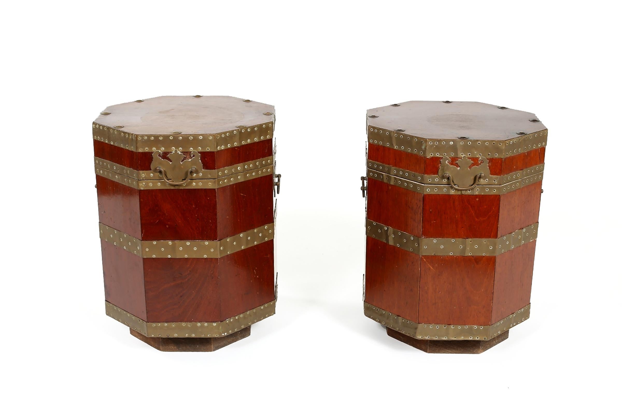 Pair of 19th century English brass-mounted lidded containers / tables with handles. Each piece is very sturdy and in good antique condition with wear appropriate to age / use. Each container / table is about 17 inches high x 13 inches diameter.