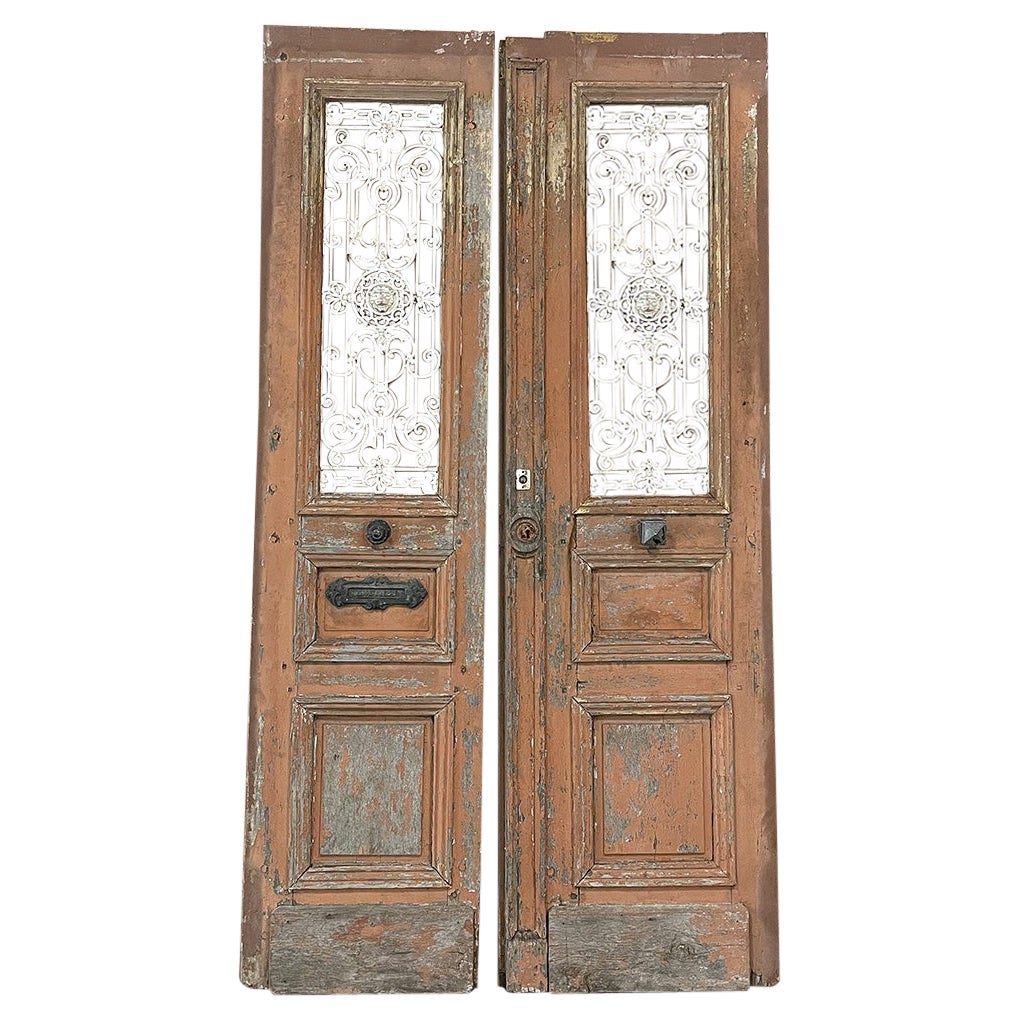 Coppia di porte francesi da esterno del XIX secolo con ferro battuto