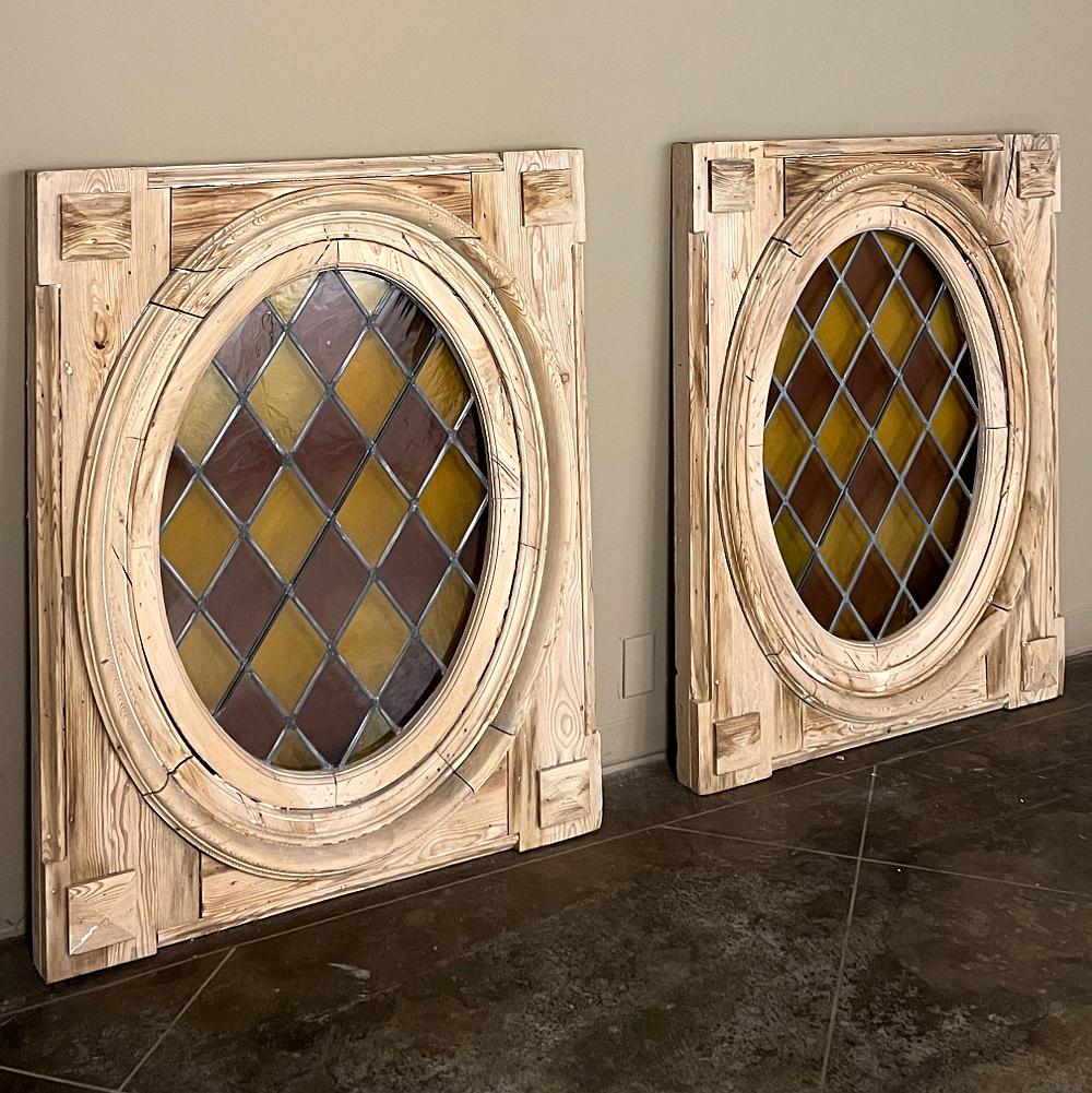Pair 19th Century Framed Oval Stained Glass Windows will make the perfect finishing touch to your remodeling or building project!  Each oval window consists of amber and light eggplant colored diamond-shaped panes, or in Louisiana parlance, Purple