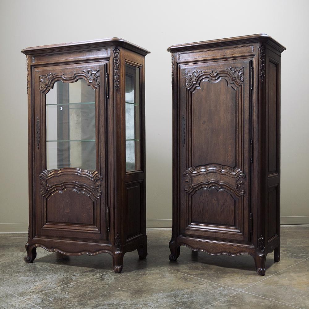 Pair of 19th century French Bonnetiere & Vitrine is an interesting combination ~ somewhat like twins that are not identical! Handcrafted from solid oak with Classic Louis XV inspired flair in the carved detail, each features elaborately framed