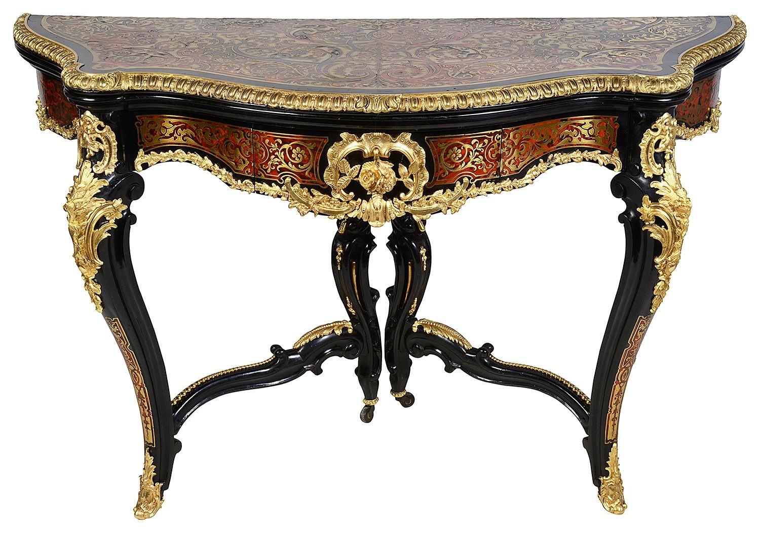 A rare pair of French 19th Century Boulle inlaid serpentine card tables. Each with wonderful red stained Tortoiseshell, inlaid classical decoration, gilded ormolu mounts and mouldings. The gate leg action supporting the open tops, revealing blue