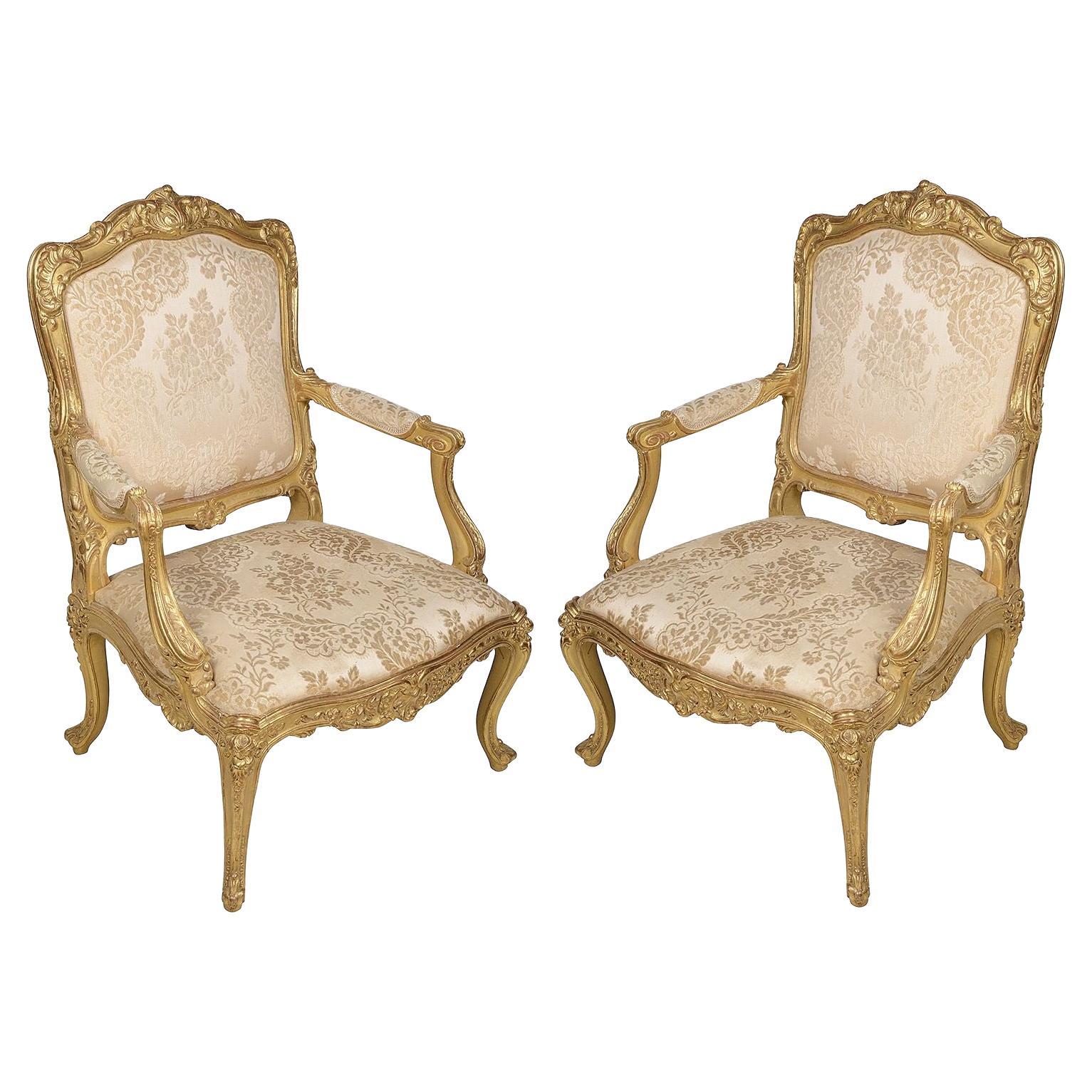 Pair 19th Century French Carved Giltwood Louis XVI Style Arm Chairs For Sale