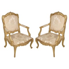 Pair 19th Century French Carved Giltwood Louis XVI Style Arm Chairs