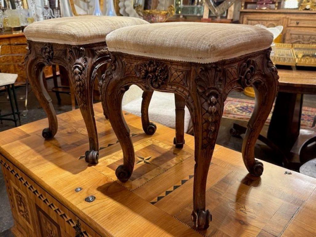 This product is a pair of 19th century French carved oak Regence stools with upholstery. These antique stools feature intricate carvings, adding a touch of elegance and history to any home.  Lovely!  Circa 1880
15.5w x 15.5d x 19.5h