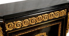 A pair of 19th Century French Ebonised Pier / Side Cabinets