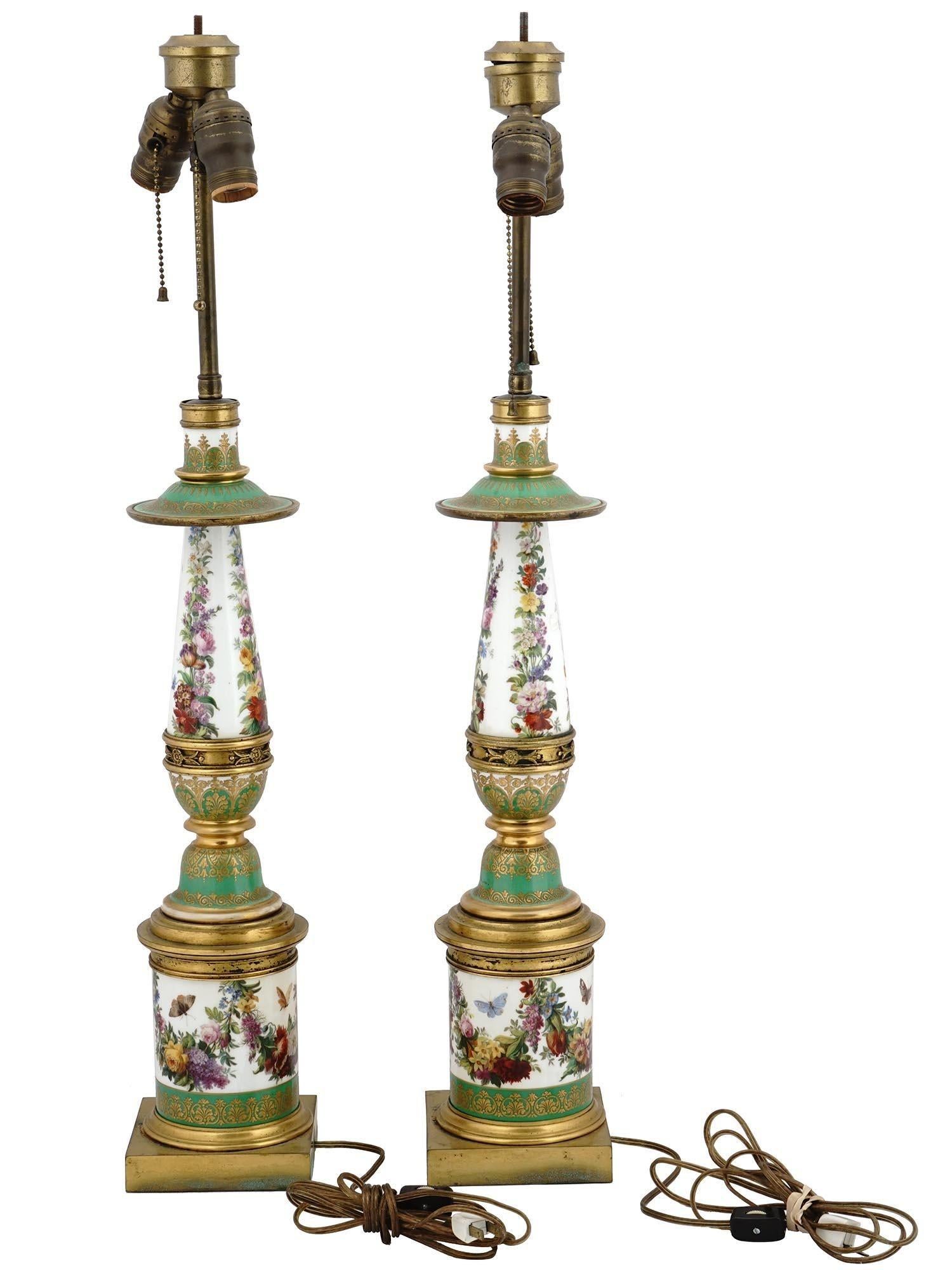 Pair 19th Century French Empire Style bronze mounted Porcelain Table Lamp with fine gilding and hand-painted floral motifs on white and green ground.