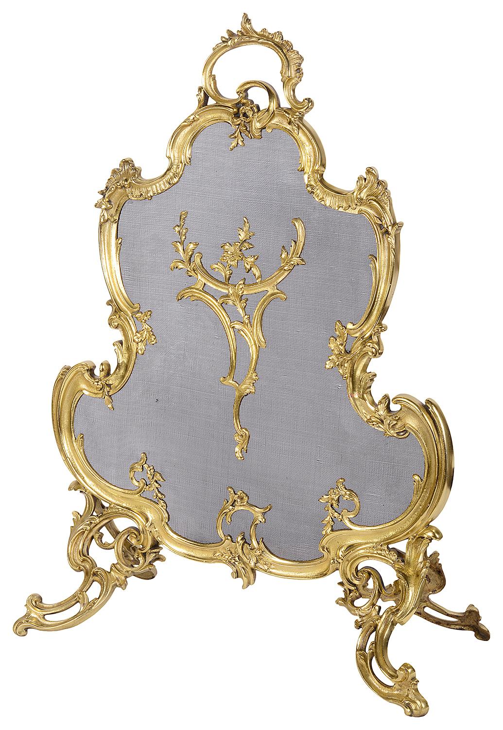 A very good quality pair of late 19th century French gilded ormolu Rococo style fire screens, each with elegant scrolling foliate decoration.
