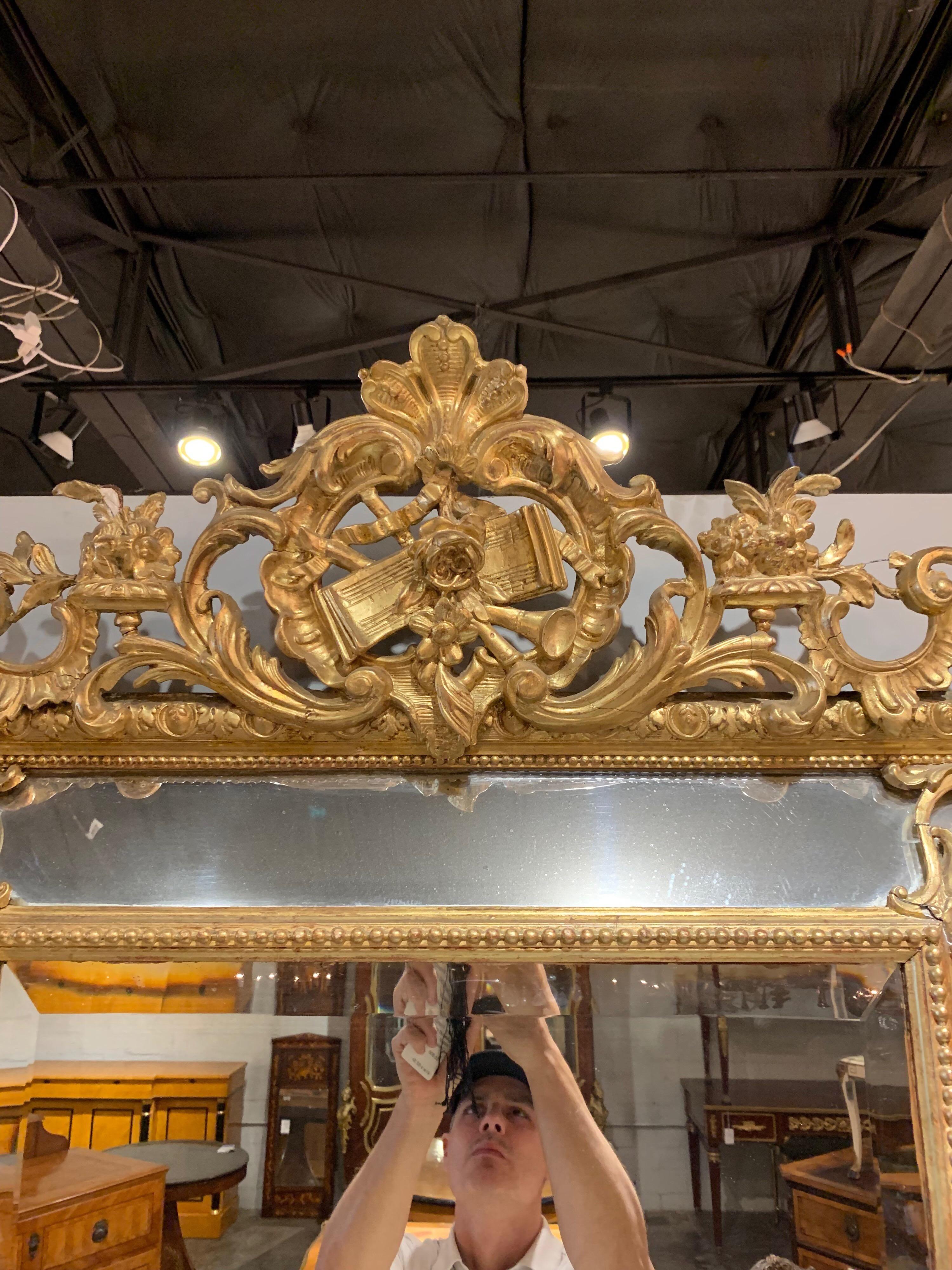 19th century French giltwood cushion mirrors. Very fine detail in the carvings that include florals, leaves, scrolls and musical instruments. Perfectly gorgeous,
circa 1860.