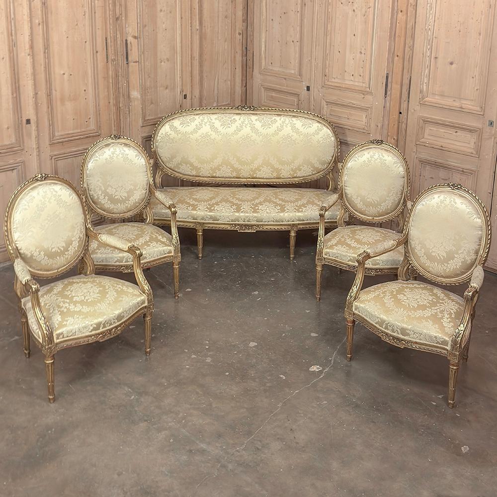 Pair 19th Century French Louis XVI Giltwood Armchairs ~ Fauteuils will make a splendid addition to any room!  Hand-crafted from select hardwood then given a gilt finish, each frame is hand-carved with floral, spiral ribbon and acanthus leaf motifs. 