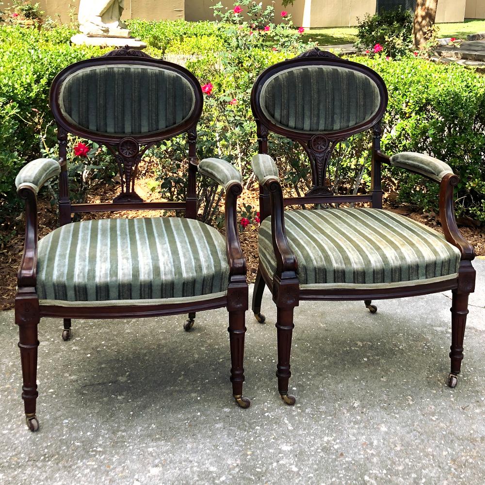 Pair 19th century French Louis XVI Mahogany armchairs ~ Fauteuils display amazing craftsmanship combined with the finest mahogany to create a classical elegance beyond compare! The curved, oval seatback is surprisingly comfortable, and is framed in