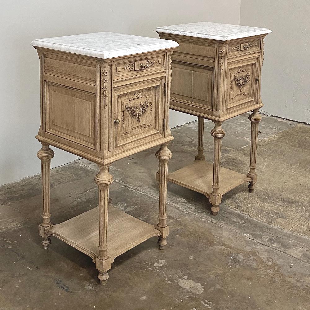 Pair of 19th century French Louis XVI marble-top nightstands were sculpted from solid oak and left in a natural unfinished state to create a casual elegance perfect for today's relaxed decors! Ideal as side tables in any family room because they're