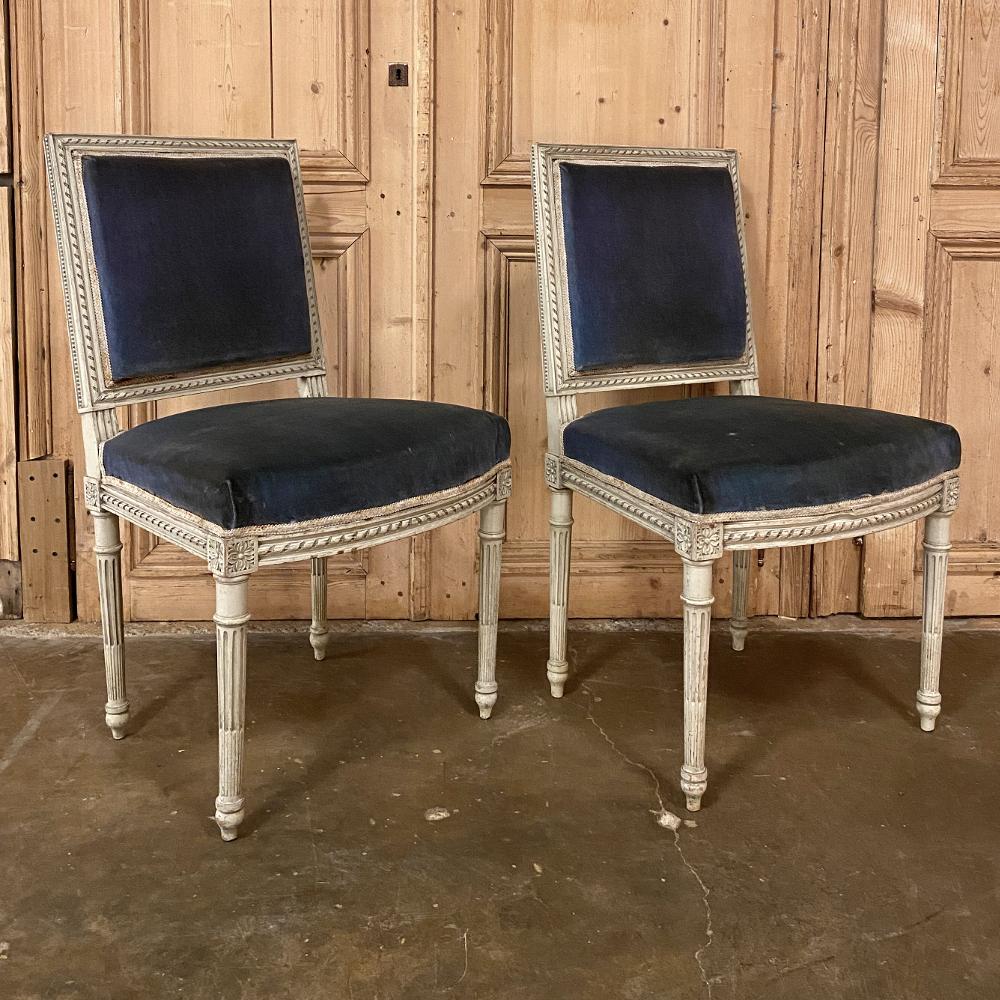 Pair of 19th century French Louis XVI painted chairs are perfect for adding an opulent touch to your decor, while simultaneously providing a soft visual accent, thanks to the painted finish which has achieved a lovely patina over the decades. Carved