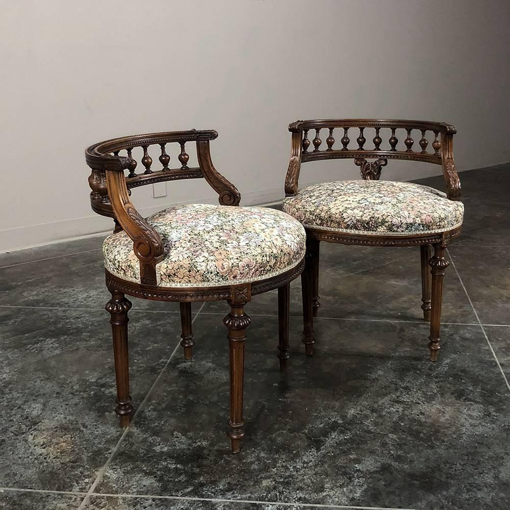 Pair of 19th century French Louis XVI vanity stools are a charming way to add symmetry to your room. Each features a partial round spindle rail which serves as a diminutive back, while support is provided by tapered and fluted legs. Each was