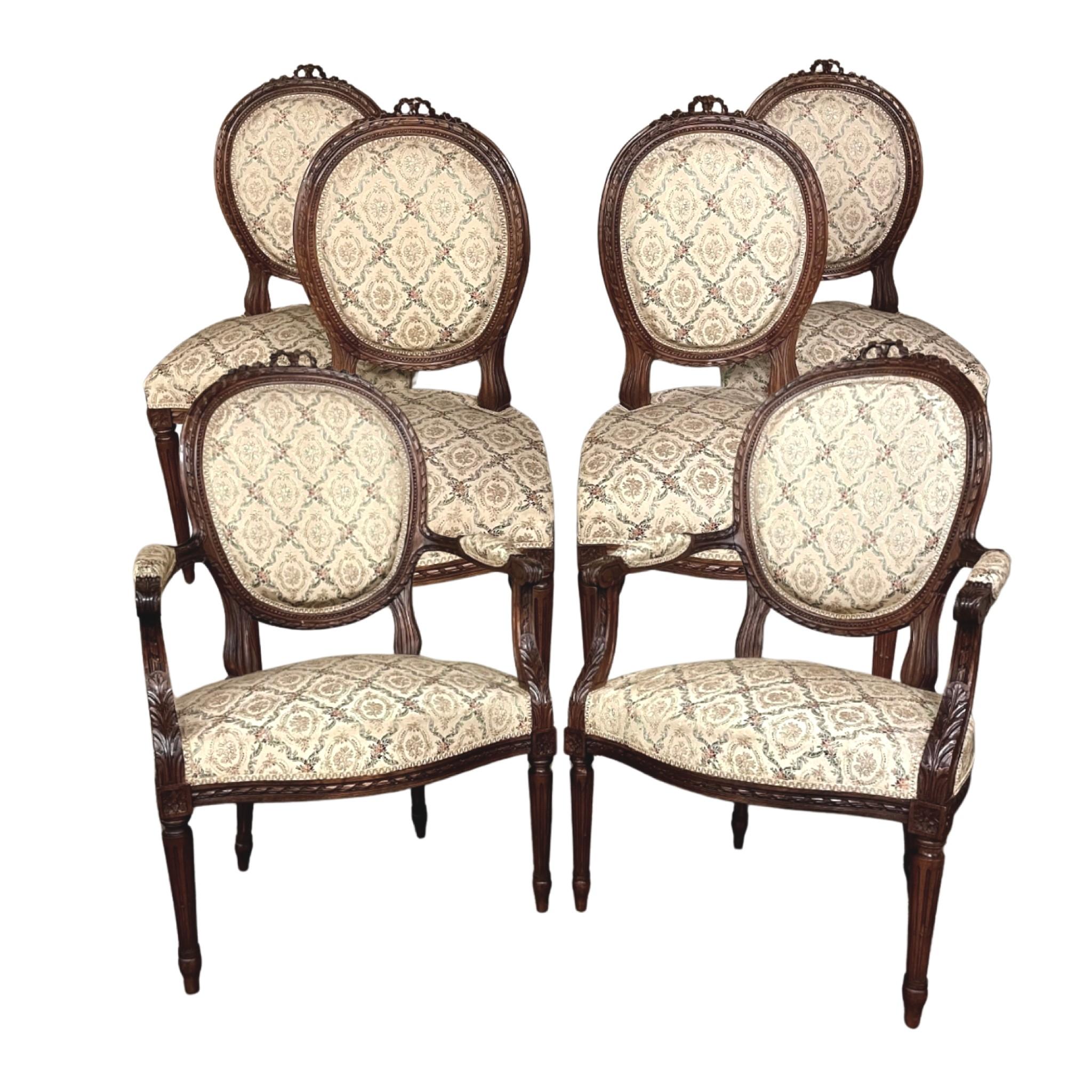 Pair 19th Century French Louis XVI walnut armchairs ~ fauteuils is truly a timeless classic! Featuring curved oval seatbacks and generous seats, the pair offers surprising comfort, and the very high quality of the upholstery ensures decades of