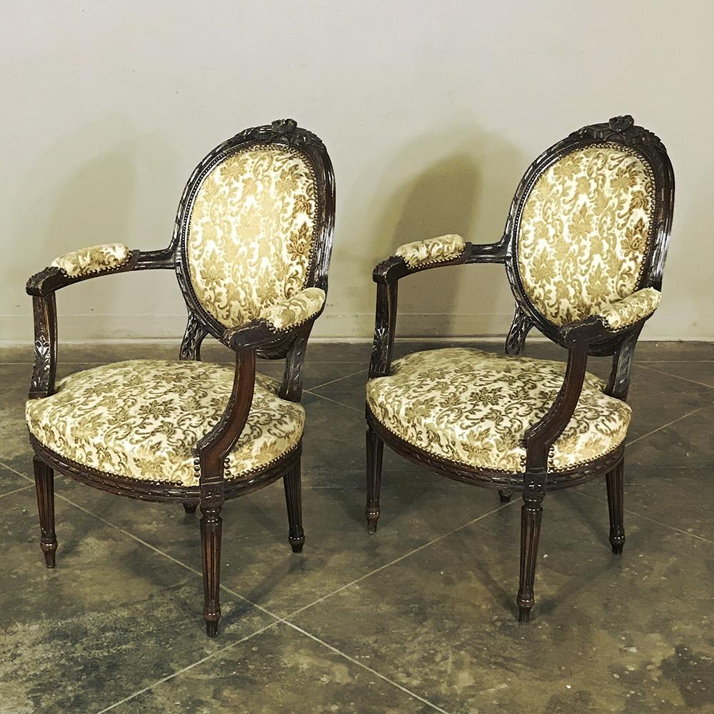 Hand-Carved Pair of 19th Century French Louis XVI Walnut Armchairs