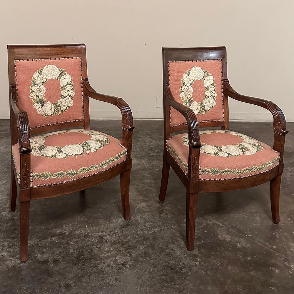 PAIR 19th Century French Mahogany Empire Armchairs with Needlepoint Tapestry were literally designed to last for centuries!  Hand-crafted from highly revered exotic imported mahogany from the Americas, the frameworks were adorned with a modicum of