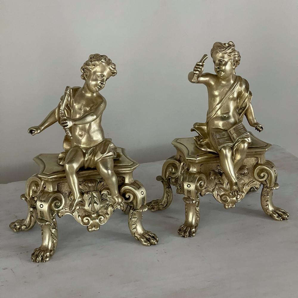 Pair 19th century French Napoleon III period bronze dore Andirons ~ bookends depict two charming cherubs playing music! Originally the decorative portion of a pair of andirons, they're perfect for decorative accents or bookends. Each figure is
