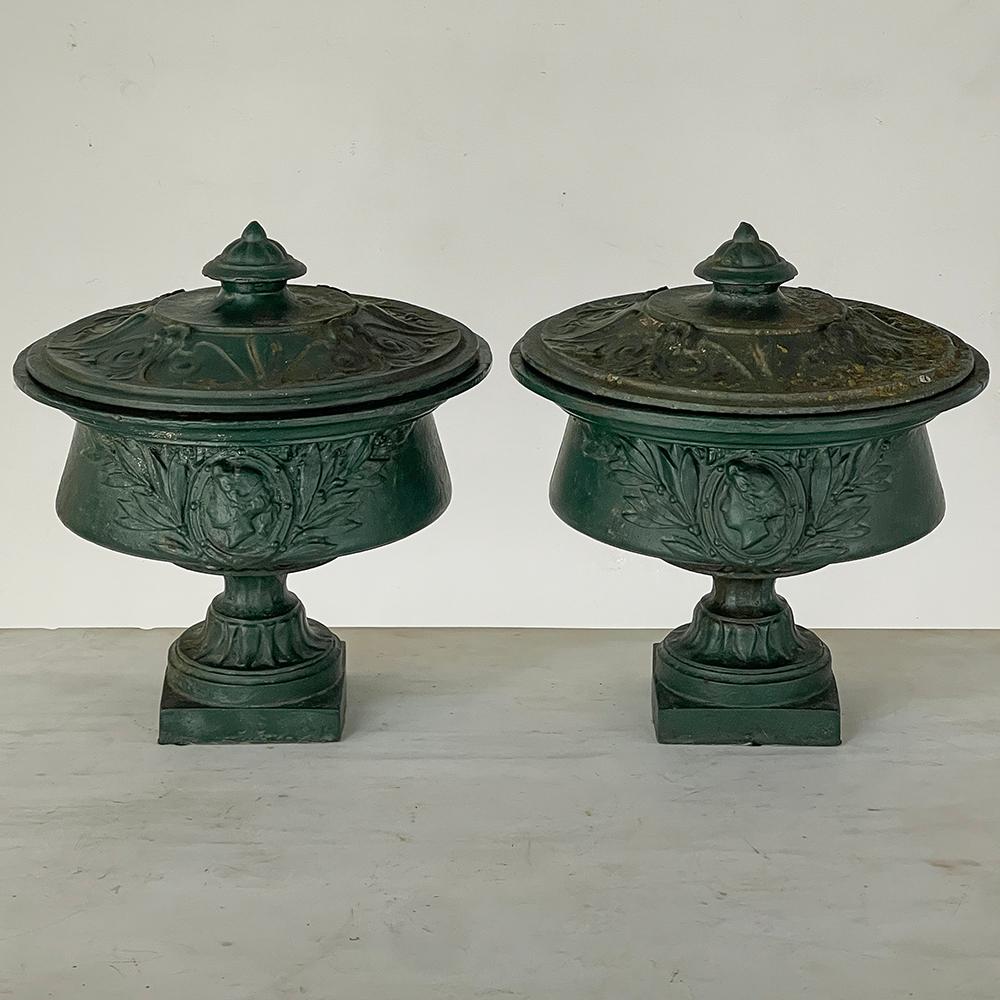 Pair 19th Century French Napoleon III Period Iron Garden Urns still show the aged forest green painted finish that was popular during the era, along with a century and a half of patina and character!  Such urns were prized possessions of homeowners