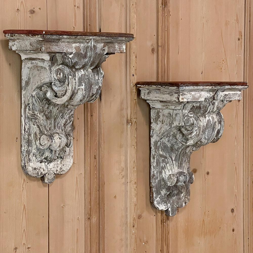 Pair 18th century French neoclassical hand-carved and painted wall sconces ~ Corbels were sculpted from solid oak and feature a timeless classical scroll festooned with acanthus flourishes above and below, rendered in full and glorious relief! The