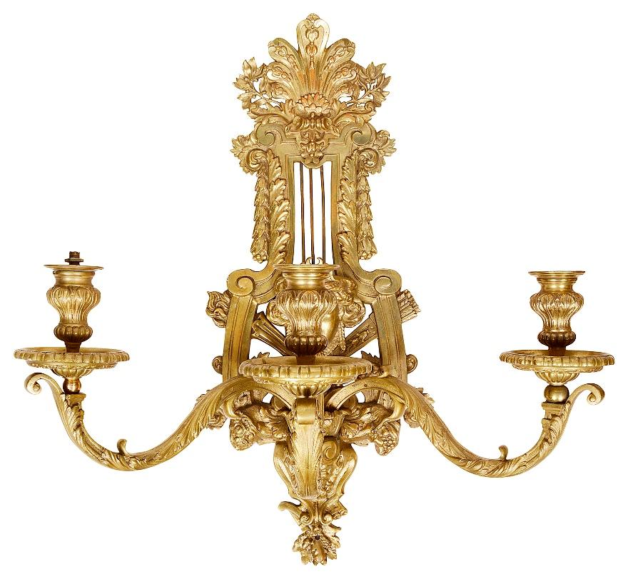 A very good quality pair of late 19th century French gilded ormolu, Louis XVI style three branch, wall sconces. Each plumed and scrolling foliate decoration, a central female mask with classical motifs, circa 1900.