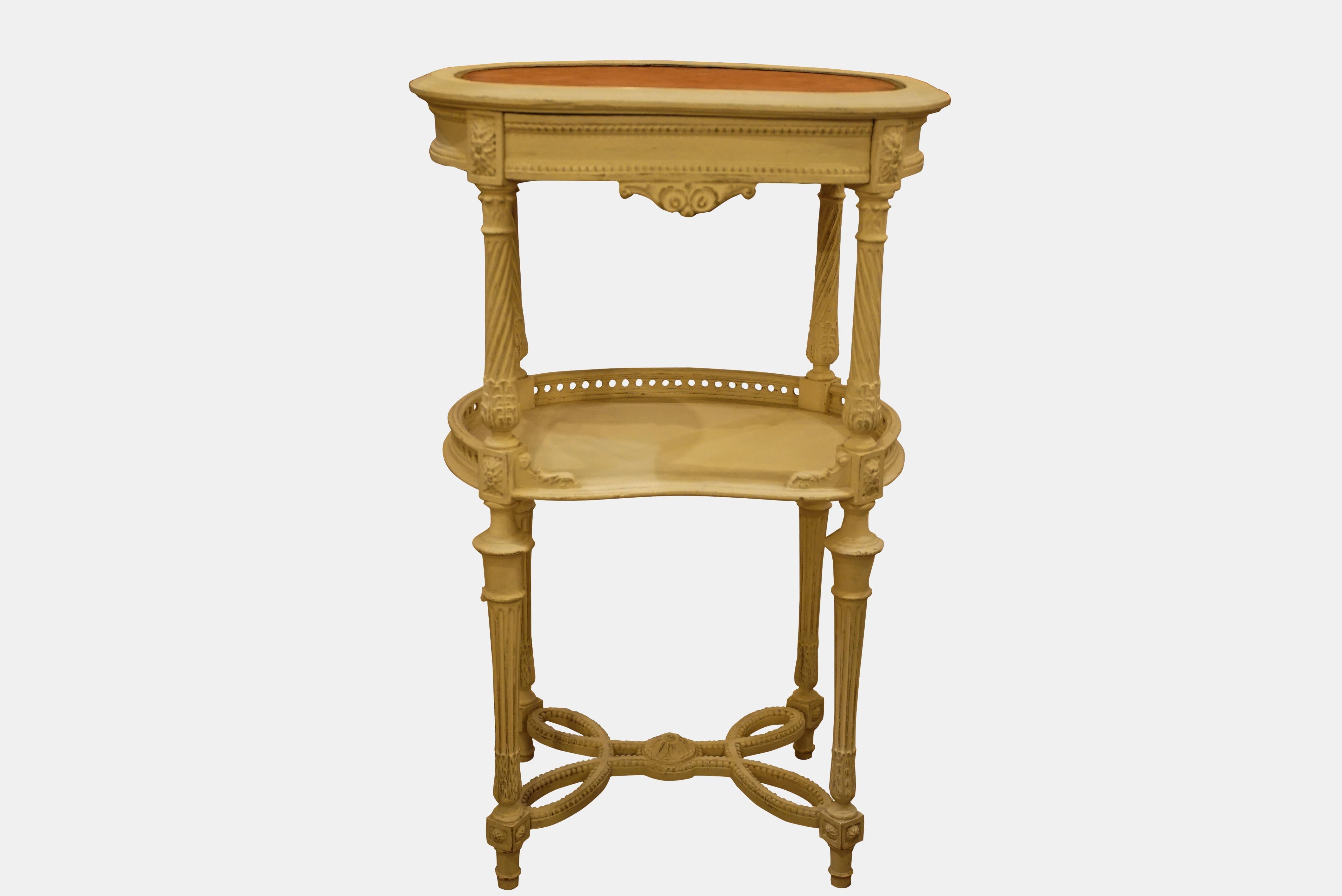 Pair of late 19th century French Painted Kidney Shape Tables, with frieze drawer and galleried undertier, beaded stretchers, the tops with faded pink velvet . Redecorated.



circa 1880.