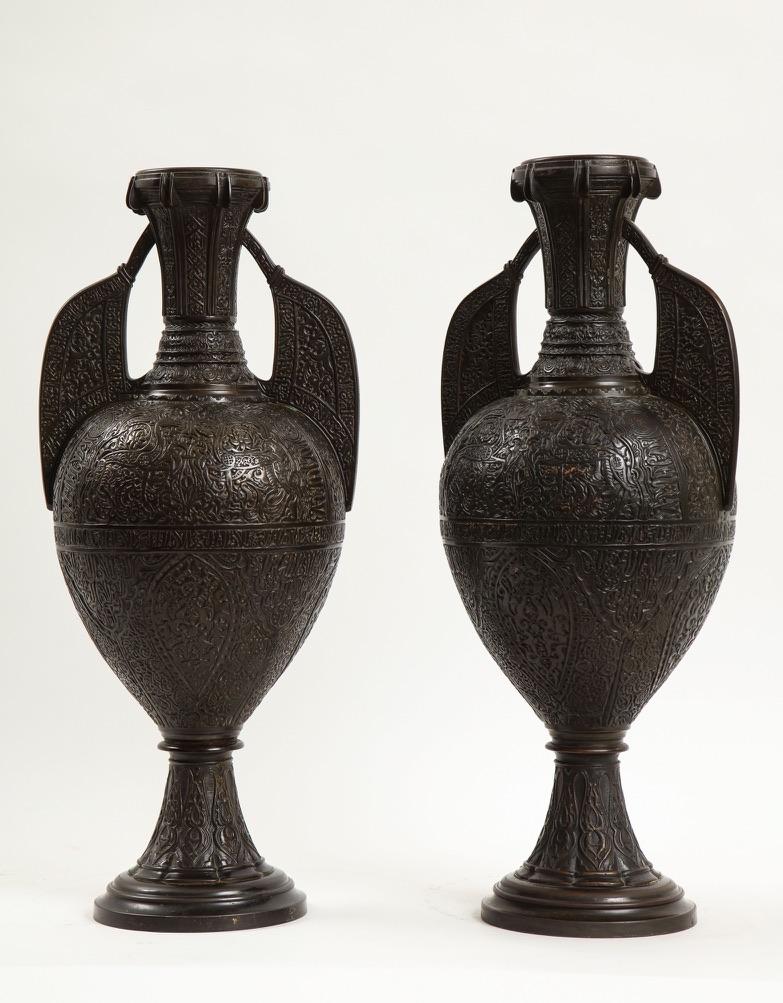 An Incredible and Rare Pair of 19th Century French Islamic Style Patinated Bronze Alhambra Vases, Stamped Tiffany & Co. The vases draw inspiration from Islamic design and the Nasrid art of the Alhambra in Granada, Spain. Modeled after medieval
