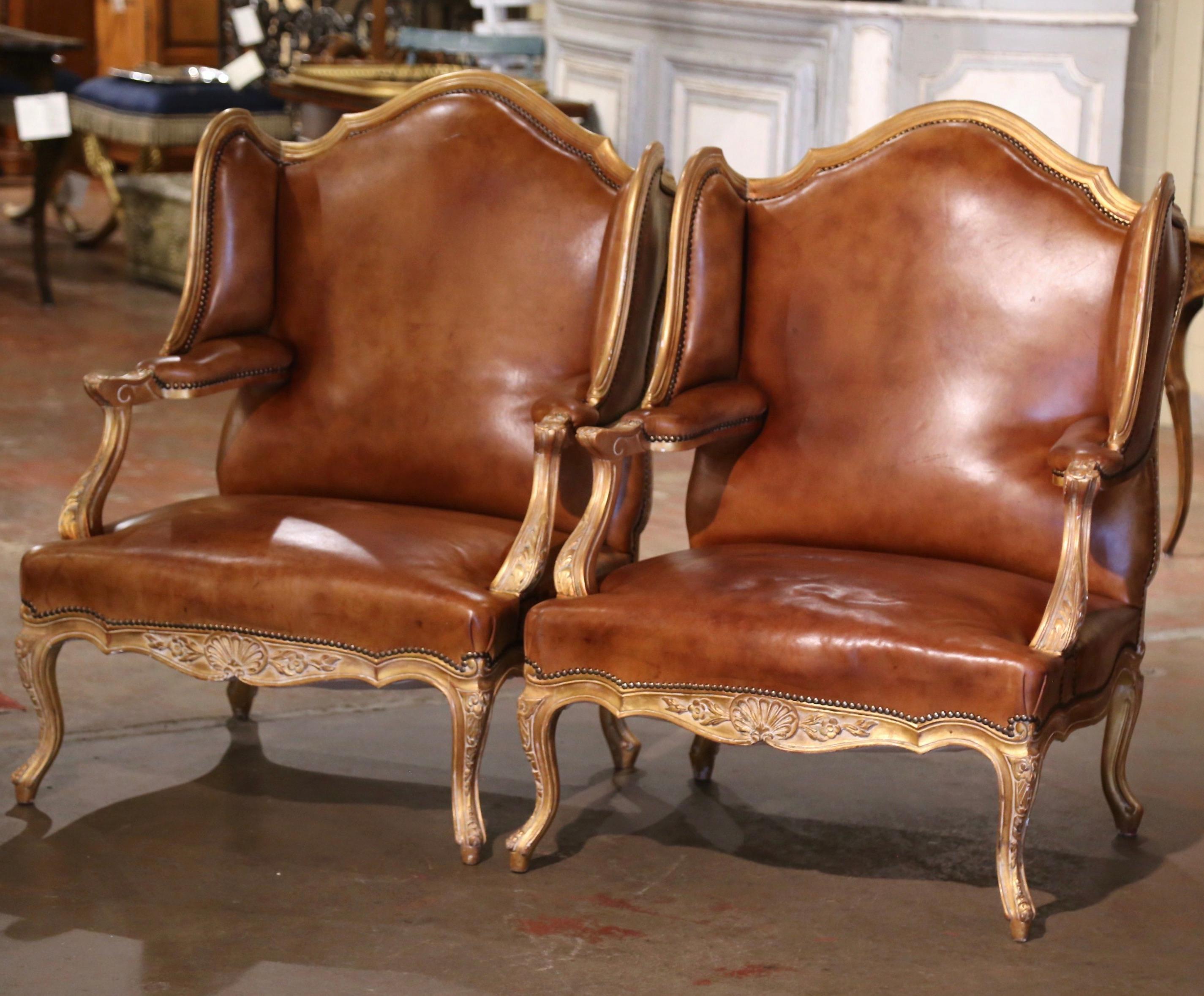 Decorate a living room, den or office with this elegant pair of antique gilt wood bergeres. Crafted in Paris circa 1870, each important 