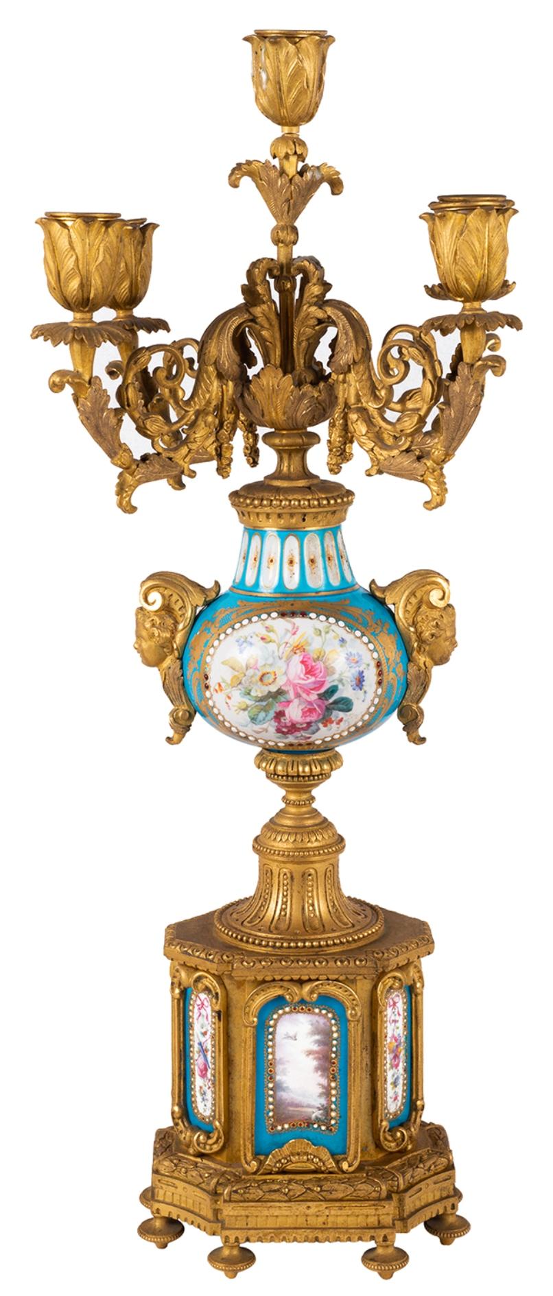 Pair late 19th century French sevres style porcelain and gilded ormolu five brach candelabra, with scrolling foliate decoration, turquoise ground porcelain urns the the centre with inset hand painted romantic scenes, floral scenes to the reverse,