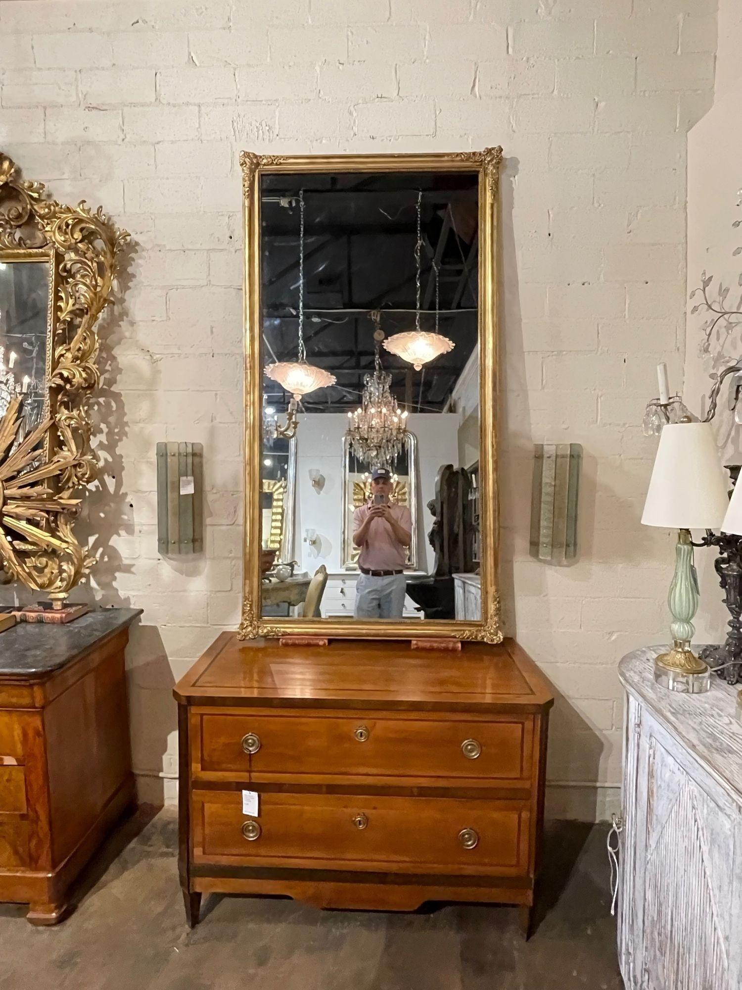 Pair of late 19th century transitional gilt-wood mirrors. Circa 1890. Adds warmth and charm to any room!