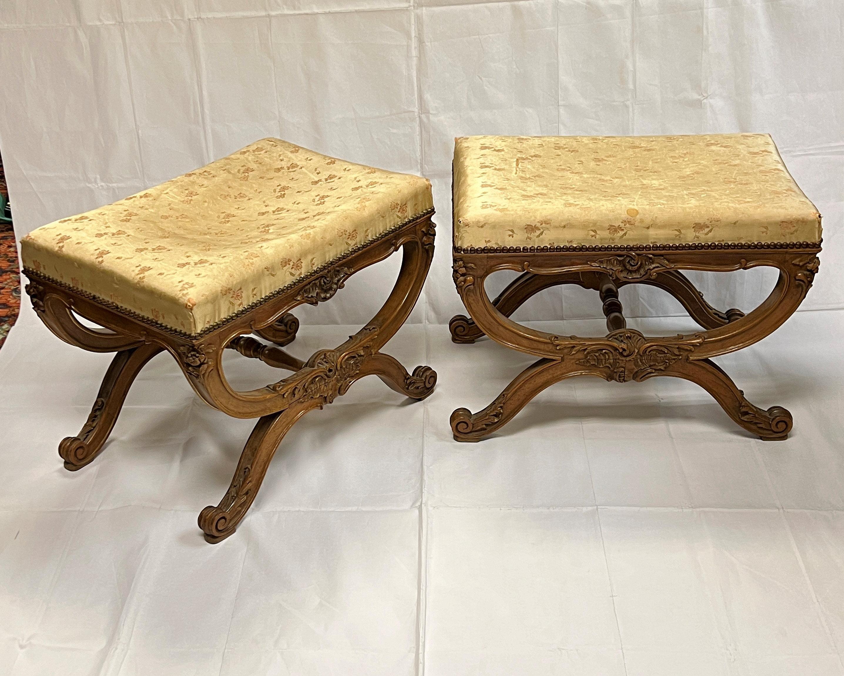 Pair of lovely antique (19th century) hand carved oak stools in the Louis XV style with their original upholstery by Eugene Salagnad of Paris.  This tapissier exhibited at the Exposition Universelle de Vienne in 1873 and the Exposition Universelle