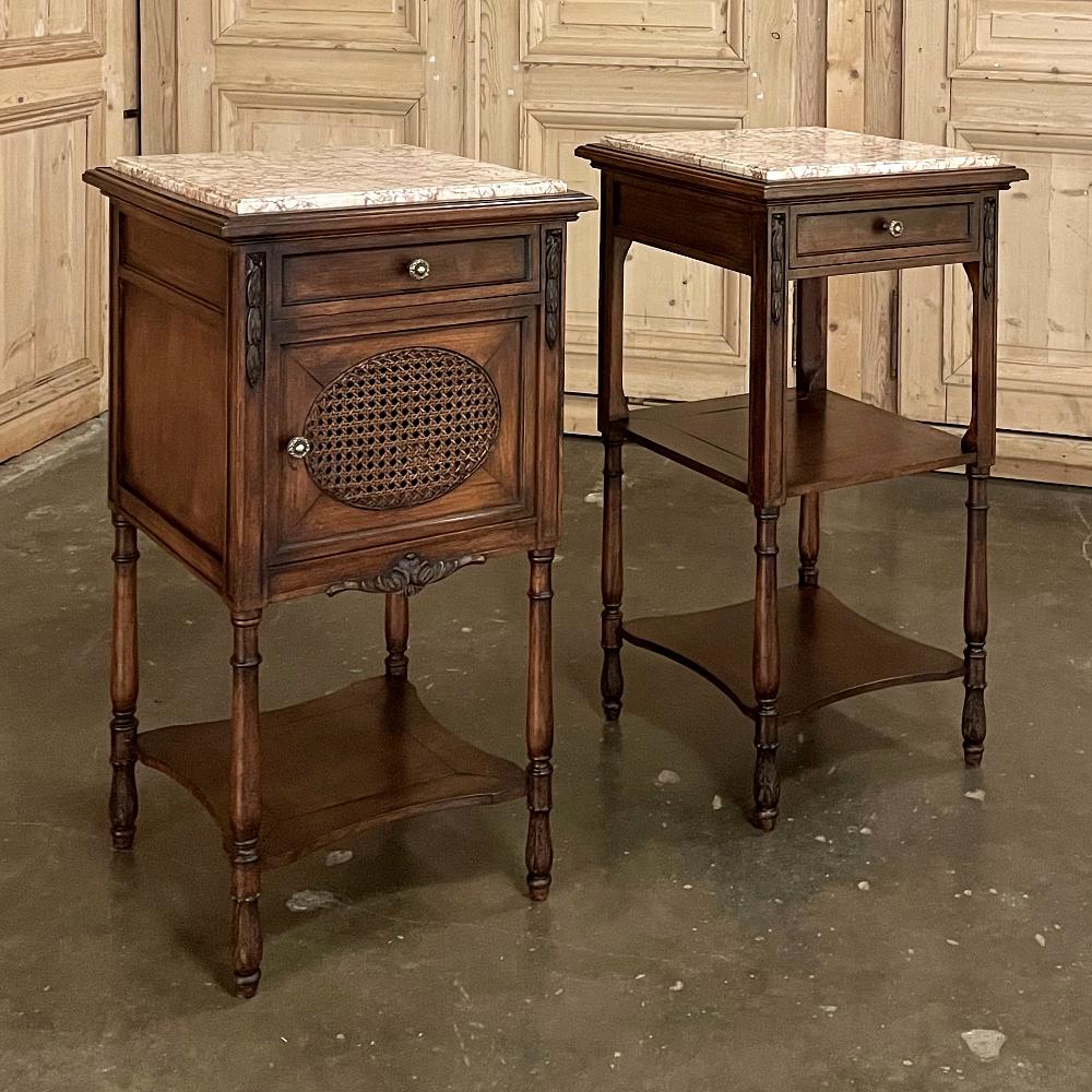 The timeless architecture that originated in ancient Greece has been reborn with this pair of 19th century French walnut neoclassical nightstands ~ complete with its original hand-carved embellishments and matching marble tops! One features two