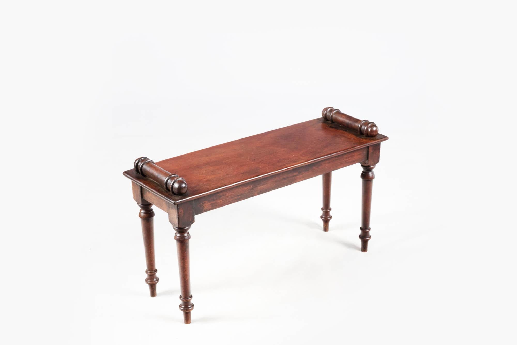 Pair 19th Century George IV Tatham Hall benches with simple planked seats, turned baluster ends, and sitting on turned tapering legs. Circa 1830.

The style of these benches is derived from Charles Heathcote Tatham's influential publication Etchings