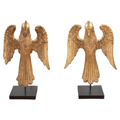 Pareja de águilas de madera dorada del siglo XIX