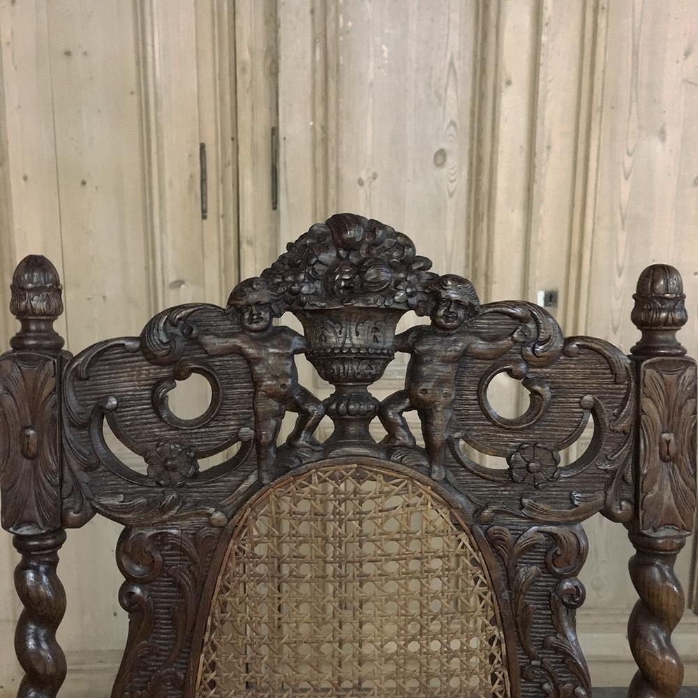 Français Paire de fauteuils de la Grande Renaissance du 19ème siècle en chêne sculpté à la main et canné en vente