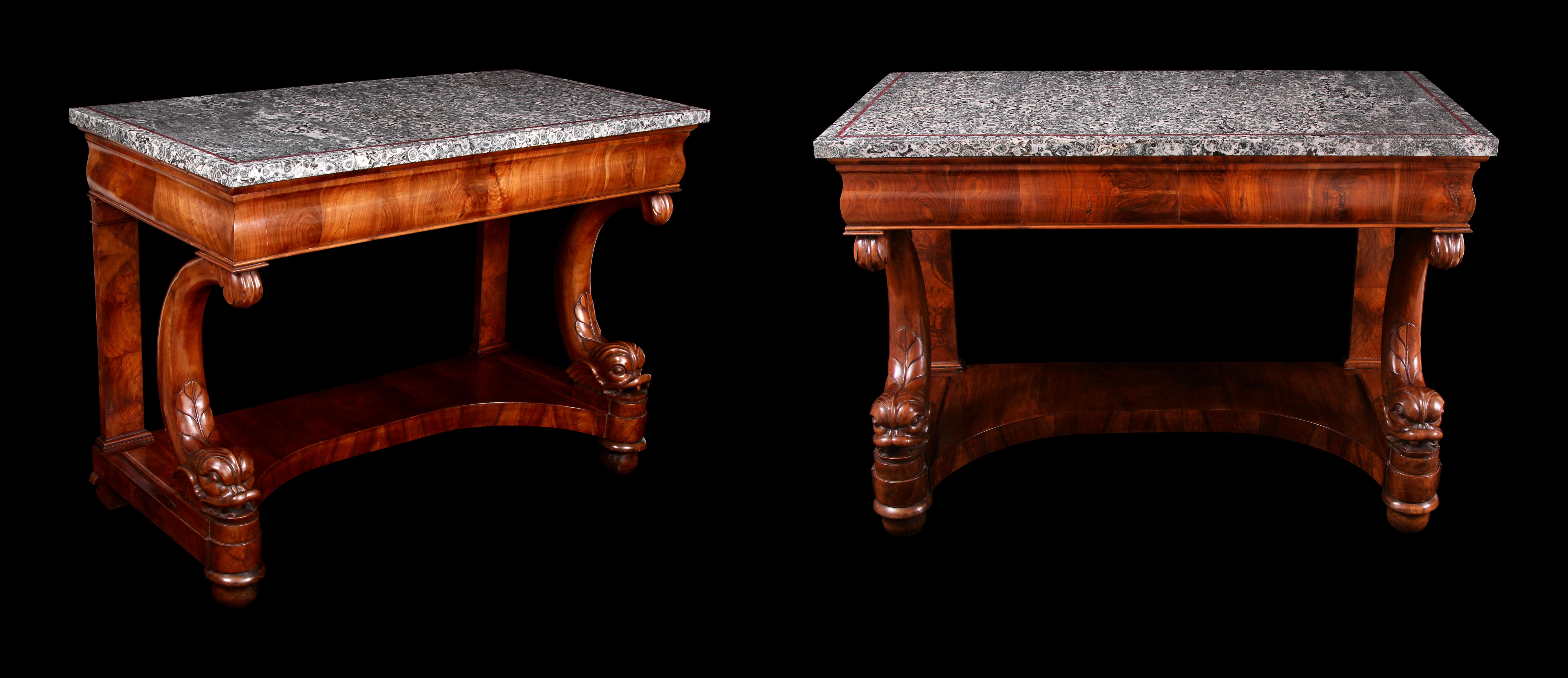 Incorporating one of the rarest stones on Earth.

Two of only a handful of tables with this stone known to exist.

Important and rare pair of early 19th century Italian Napoleonite and figured walnut stylized dolphin console tables, circa 1810.