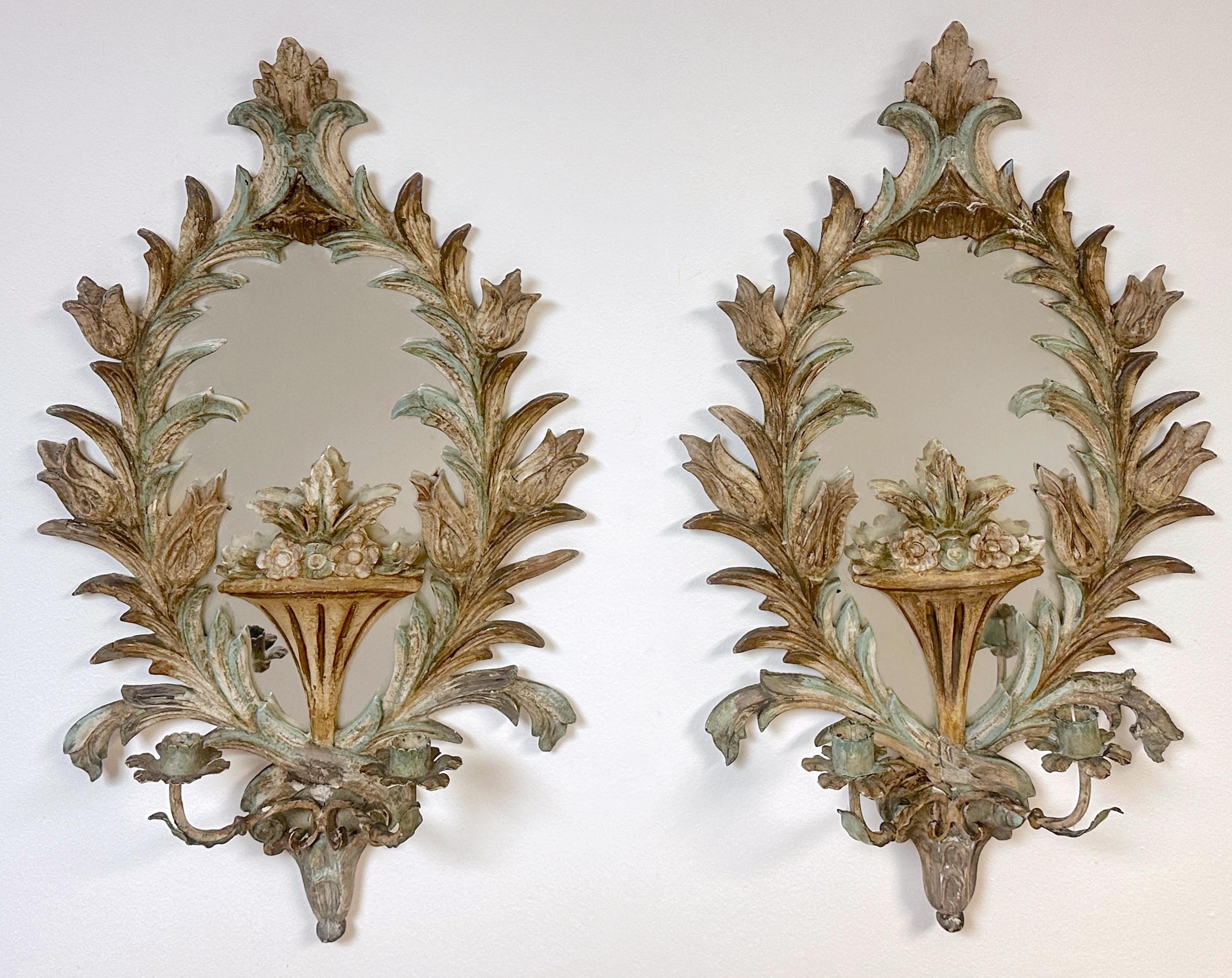 Pair of 19th Century Italian Painted Rococo Wall Mirrors with Candle Holders

Possibly Venetian Hand-Carved & Painted Circa 19th Century or Older

This exquisite pair of 19th-century or older Italian wall mirrors, possibly Venetian, showcases the
