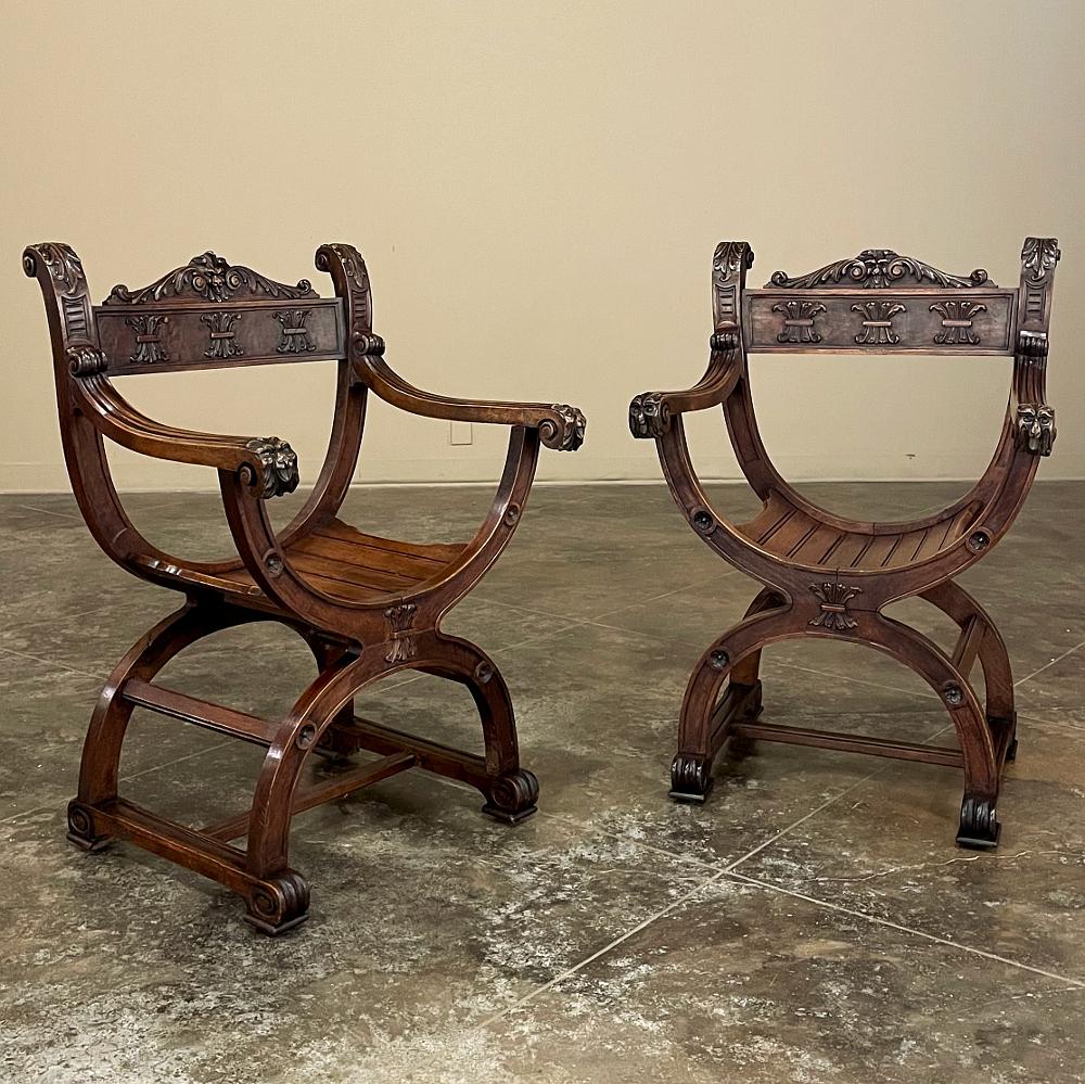 Pair 19th Century Italian Walnut Renaissance Revival Dagobert Armchairs are derived from a design that dates back millennia to ancient Egypt!  The criss-cross placement of the framing creates a cradling effect, yet the legs curve out for extra