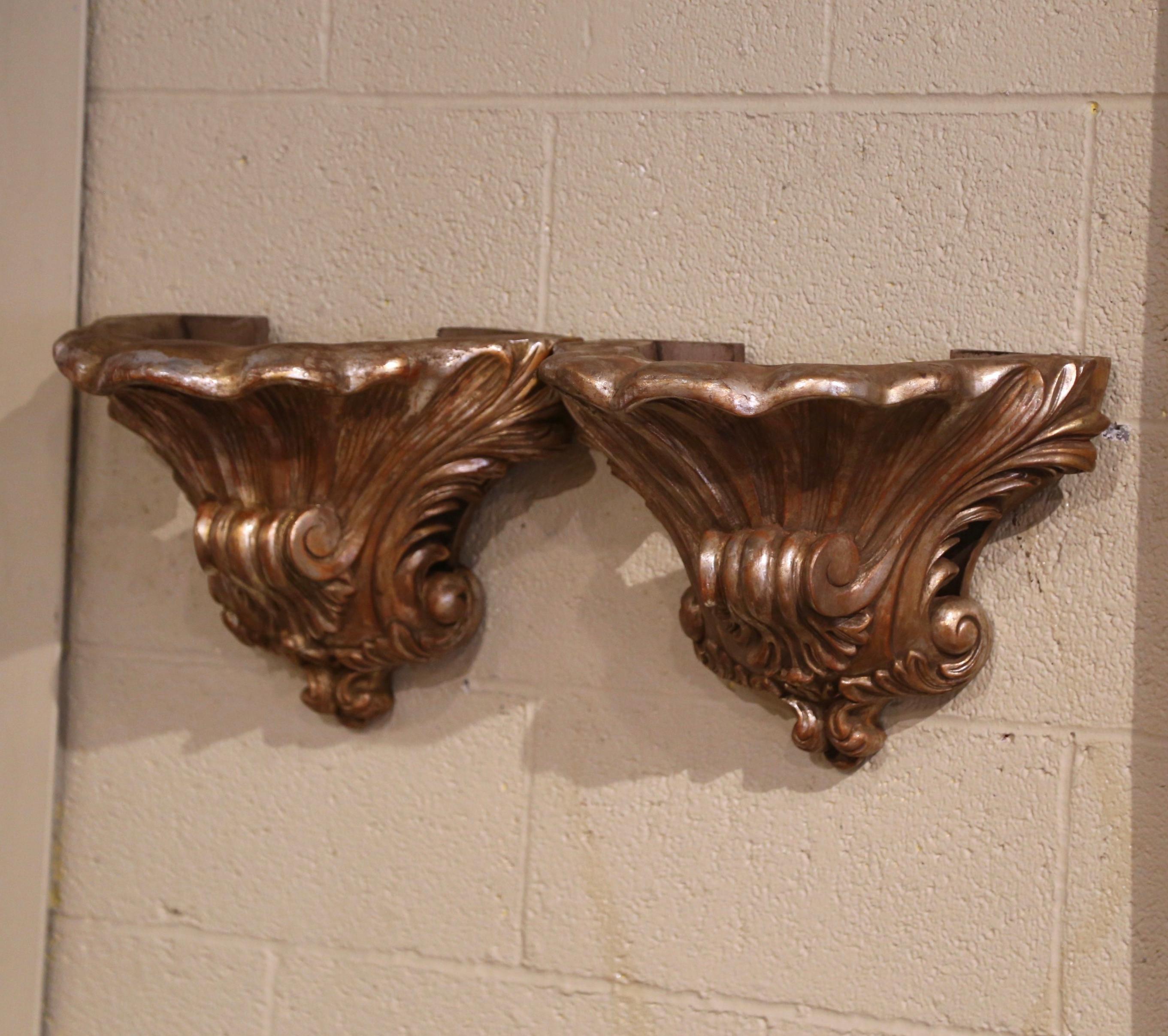 Decorate a wall with this elegant pair of antique walnut corbels. Crafted in Southern France, circa 1860, each fruitwood wall bracket features a motif reminiscent of classical or Rococo-style ornamentation, often seen in 18th-century European