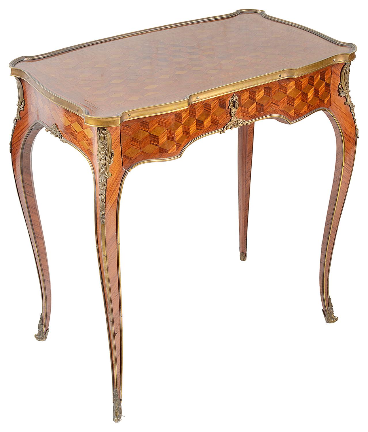 A good quality pair of late 19th century Louis XVI style parquetry inlaid side tables, each with gilded ormolu mounts, a single oak lined frieze drawer, raised on elegant cabriole legs terminating in scrolling ormolu feet.