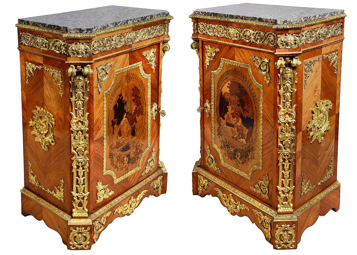 A fine quality pair of French 19th Century marble topped, marquetry inlaid pier cabinets. Each with wonderfully impressive gilded ormolu mounts and mouldings. The inlaid panels to the doors depicting a courting couple, raised on plinth