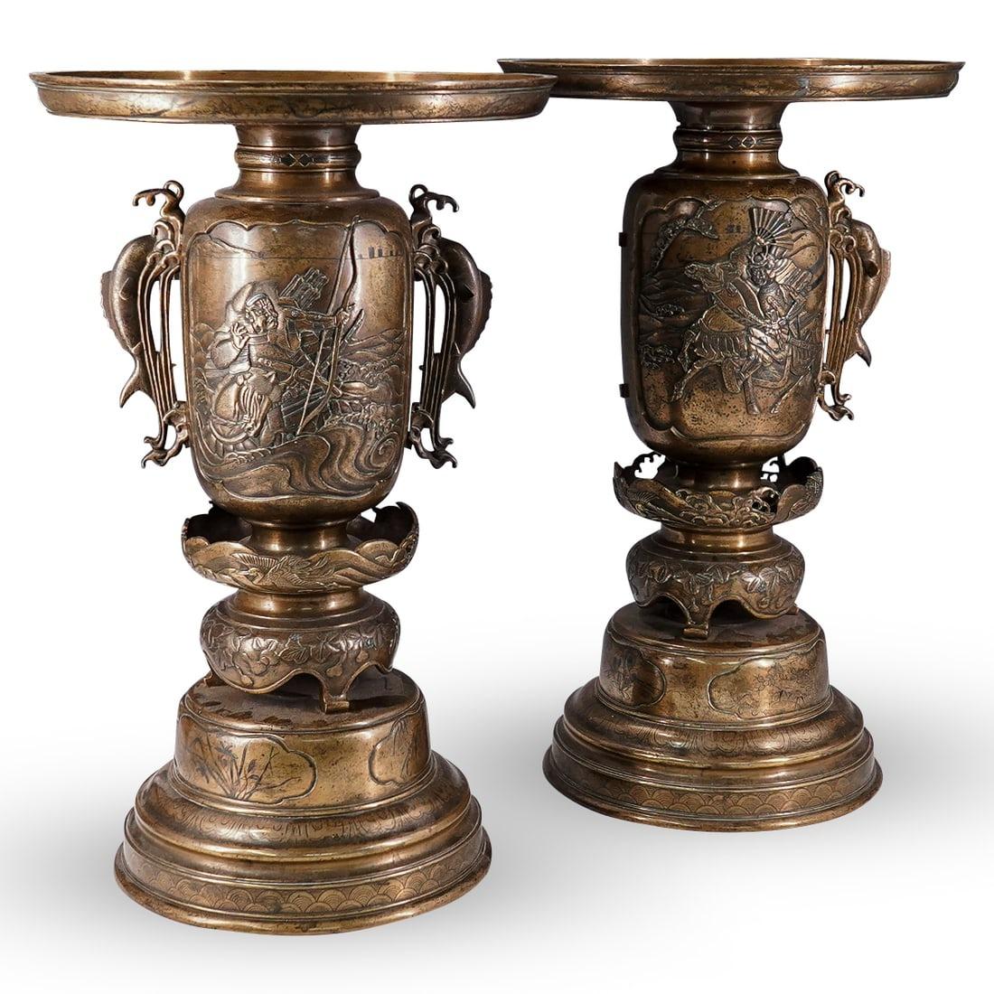 Pair of antique (late 19th century) Meiji period Japanese usabata ikebana vases crafted in four sections and measuring an impressive 18 3/4 inches tall.  Each with cartouches depicting warriors at sea and on horseback, inlaid with copper and silver.