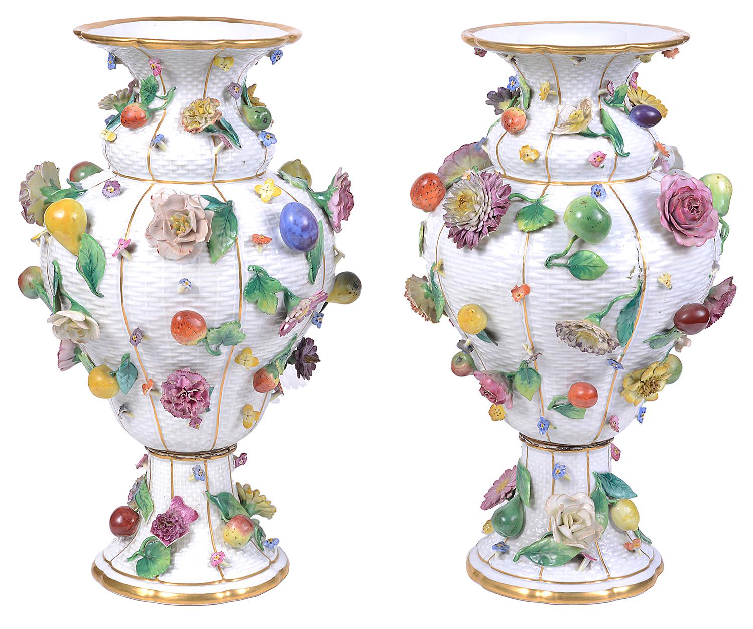 A very good quality pair of 19th century Meissen Porcelain flower encrusted vases, each with a white basket weave ground, wonderful brightly colored flowers and fruit.
Signed to the bases with Blue crossed swords.